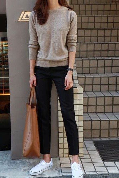 Women's Business casual outfit with a casual sweater, black trousers and sneakers